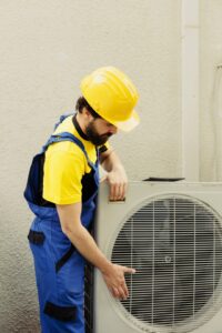 certified technician getting new outdoor air conditioner ready after replacing old busted unit trained engineer contracted install new condenser make sure it operates maximum power