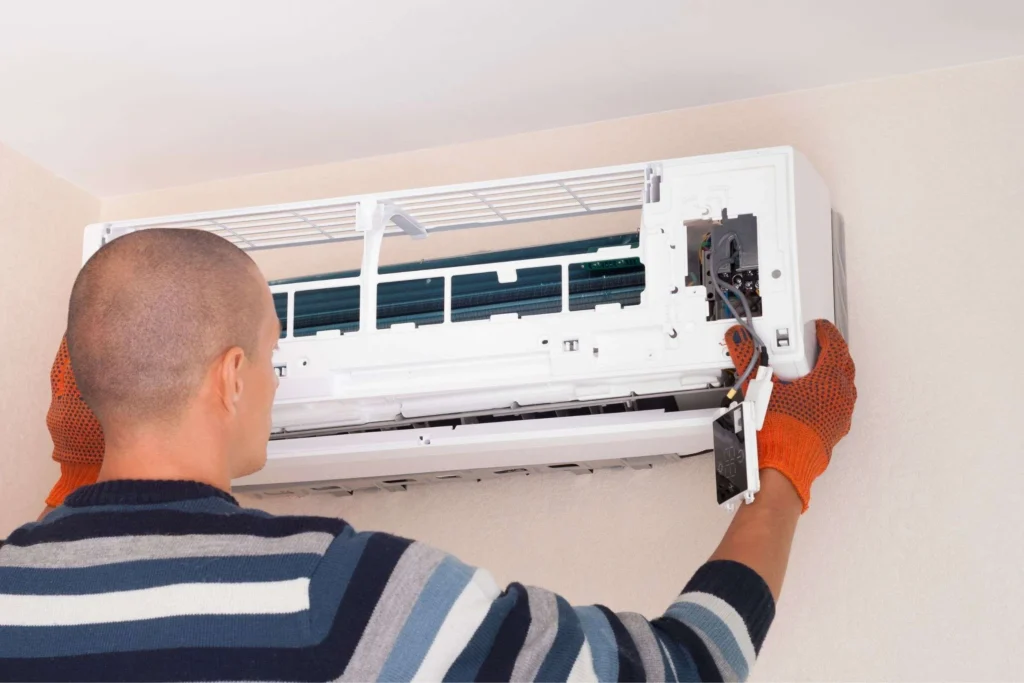 tech doing ac repairs